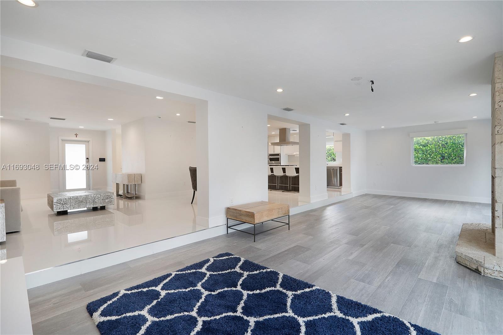 9611 Southwest 59th Terrace Miami, FL 33173 - Photo 8 of 32 a living room with furniture and a rug