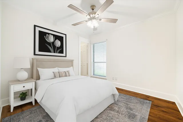 a bathroom with a granite countertop sink a toilet and bathtub