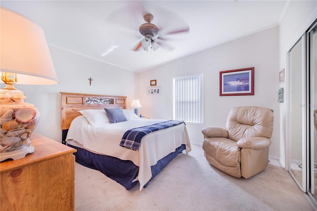 332 Fairway Boulevard Frostproof, FL 33843 - Photo 18 of 56 a bedroom with a bed and couch