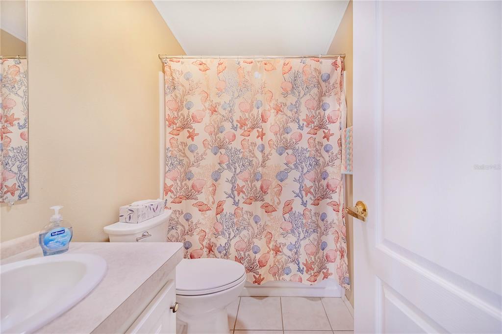 332 Fairway Boulevard Frostproof, FL 33843 - Photo 19 of 56 a bathroom with a sink toilet and shower