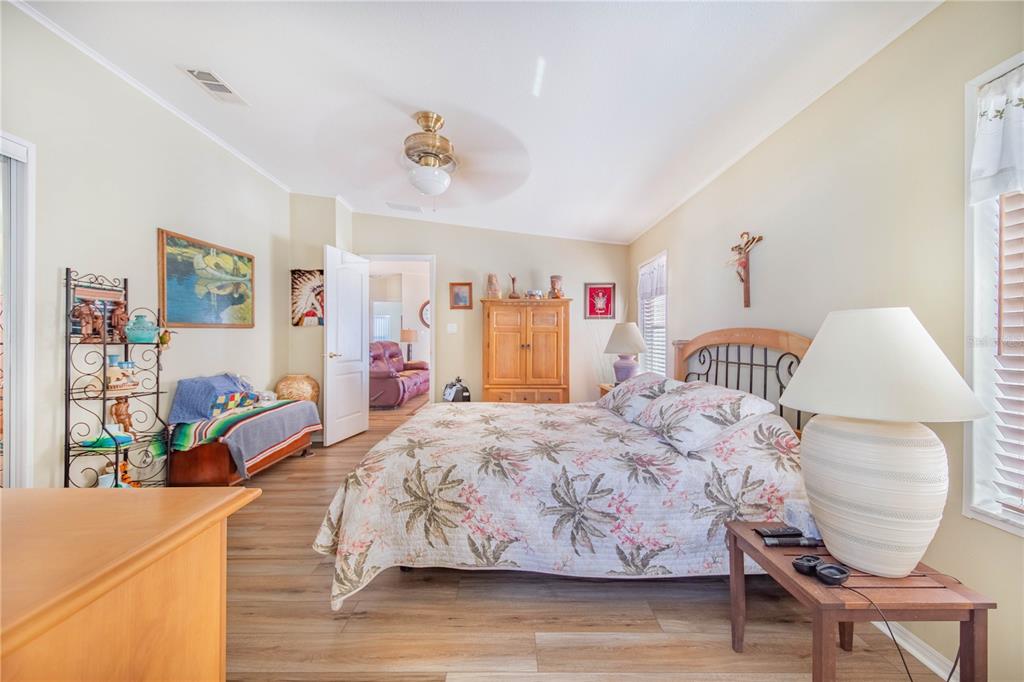 332 Fairway Boulevard Frostproof, FL 33843 - Photo 21 of 56 a bedroom with a bed and a chair