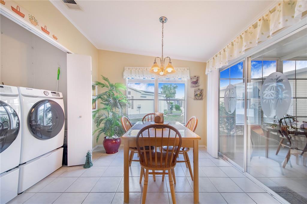 332 Fairway Boulevard Frostproof, FL 33843 - Photo 30 of 56 a view of a dining room with furniture window and outside view