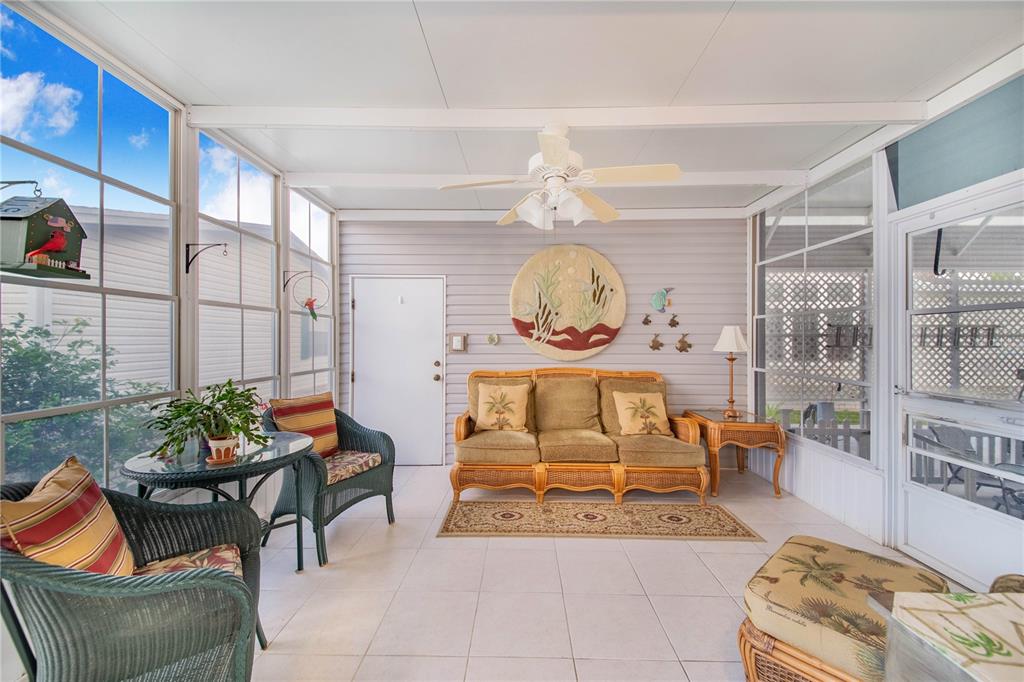 332 Fairway Boulevard Frostproof, FL 33843 - Photo 31 of 56 a living room with furniture and a potted plant
