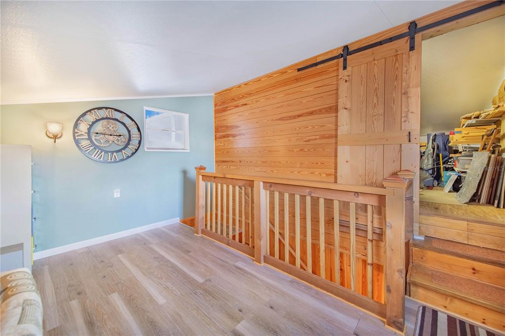 332 Fairway Boulevard Frostproof, FL 33843 - Photo 38 of 56 a view of a hallway with wooden floor