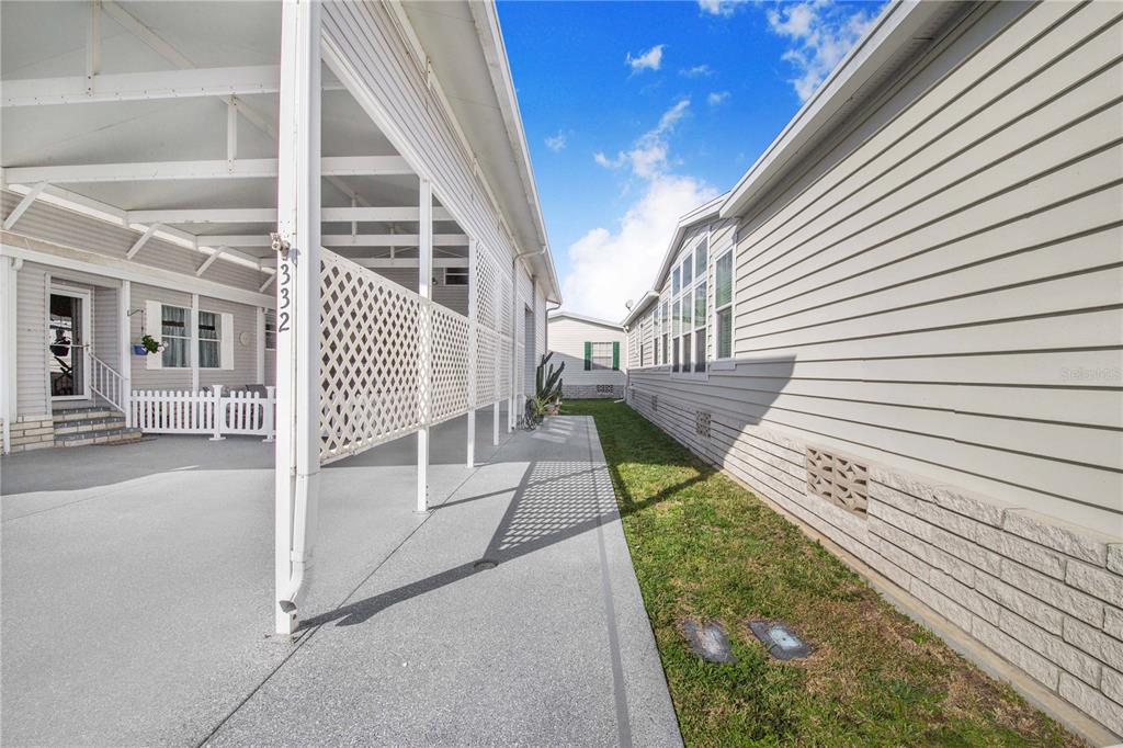 332 Fairway Boulevard Frostproof, FL 33843 - Photo 6 of 56 a view of a house with a small yard and wooden floor and fence