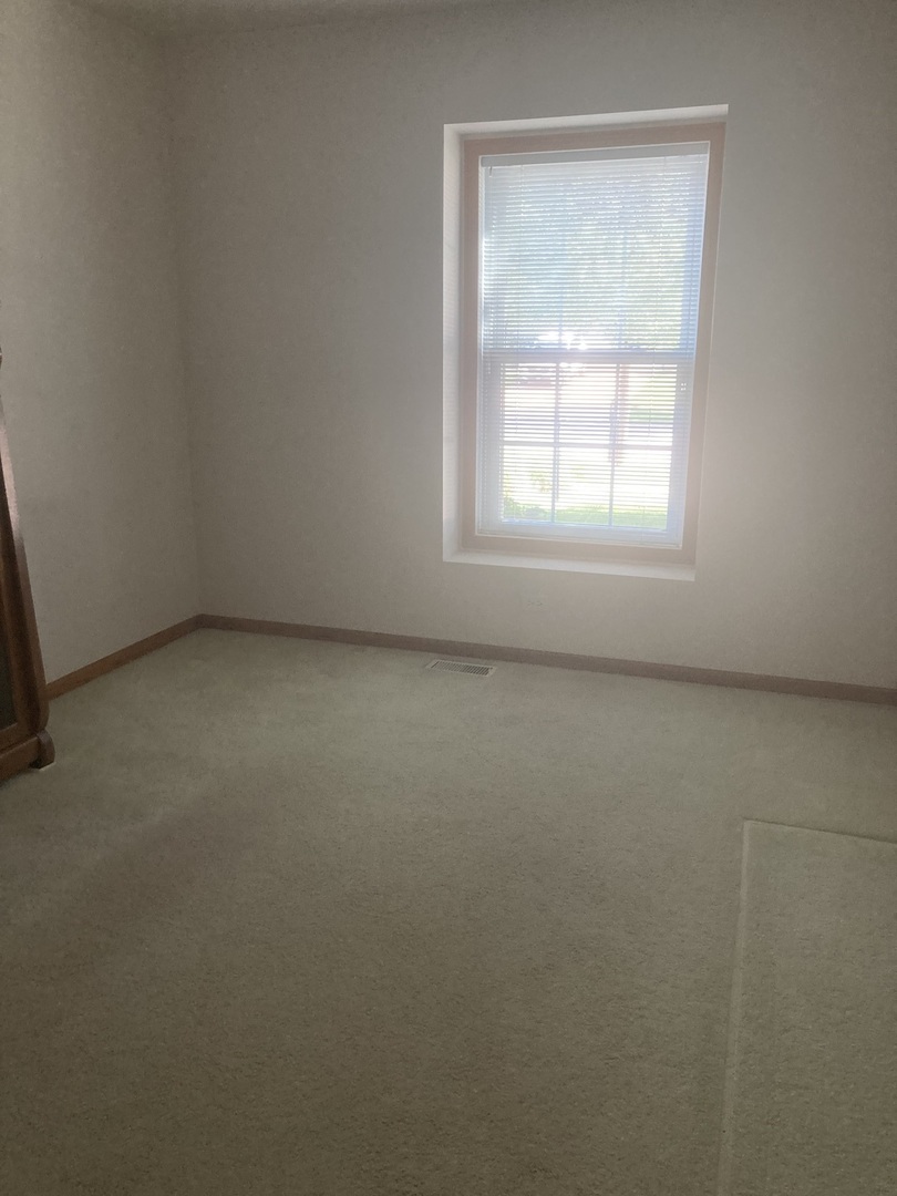 Undisclosed Address Joliet, IL 60435 - Photo 11 of 20 an empty room with a window