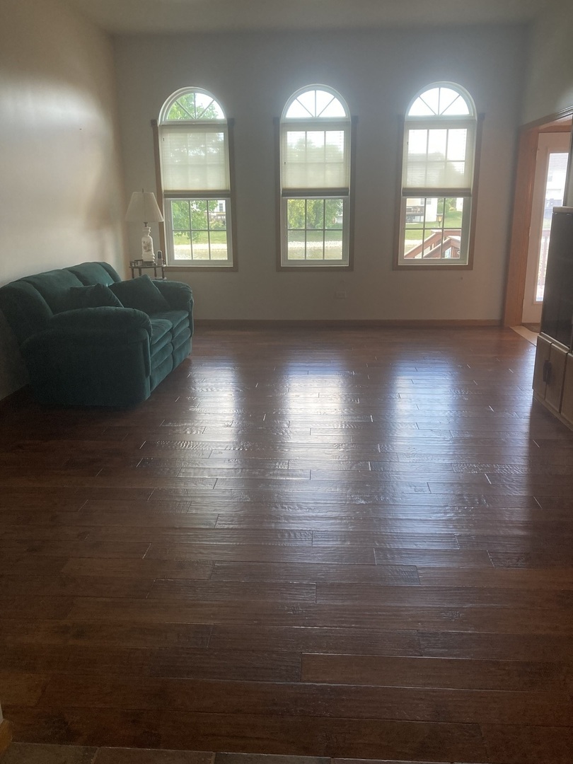 Undisclosed Address Joliet, IL 60435 - Photo 2 of 20 an empty room with wooden floor and windows
