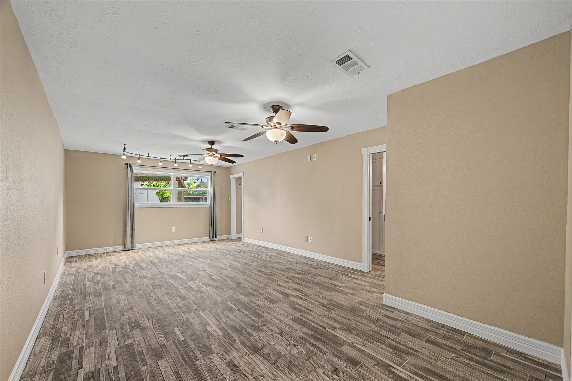 4210 Mossygate Drive Spring, TX 77373 - Photo 20 of 33 Oversized primary bedroom located on the opposite side of the home from the secondary bedrooms for added privacy, featuring two large walk-in closets and an ensuite bathroom.