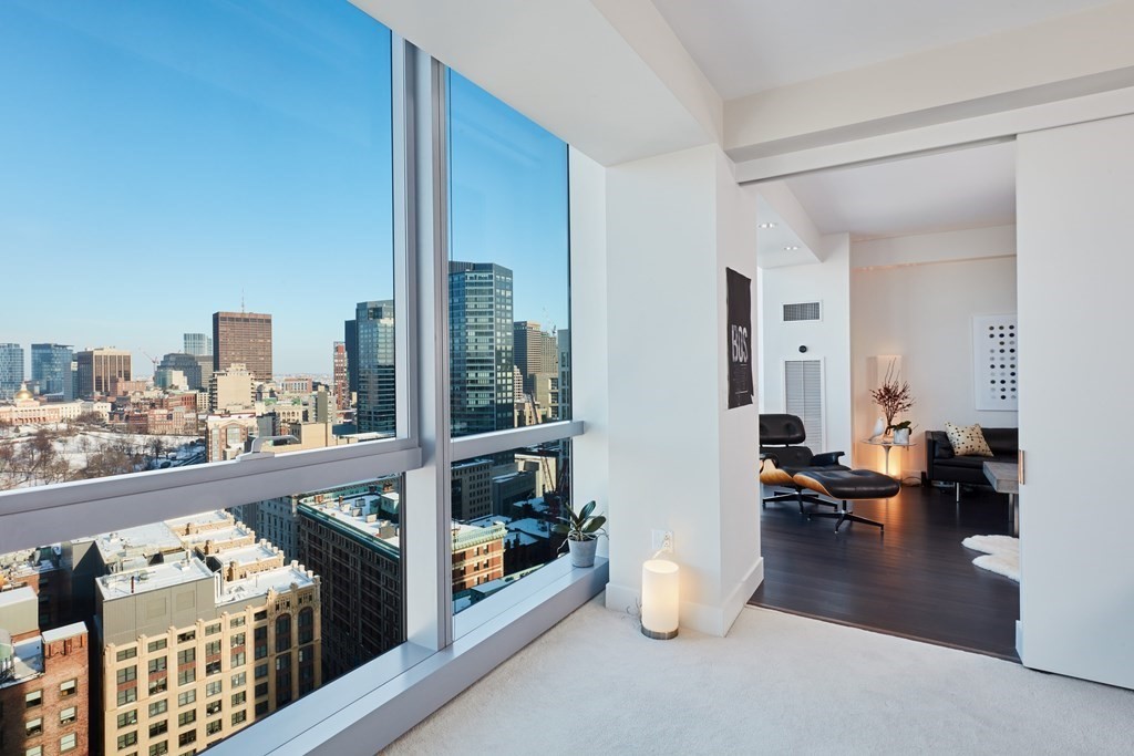 110 Stuart Street, Unit 26F Boston, MA 02116 - Photo 11 of 24 a view of a living room and a livingroom with furniture