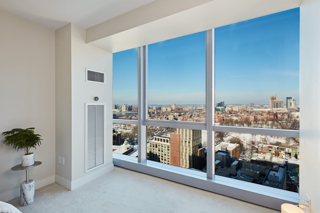 110 Stuart Street, Unit 26F Boston, MA 02116 - Photo 12 of 24 a view of a porch with a floor to ceiling window and wooden floor