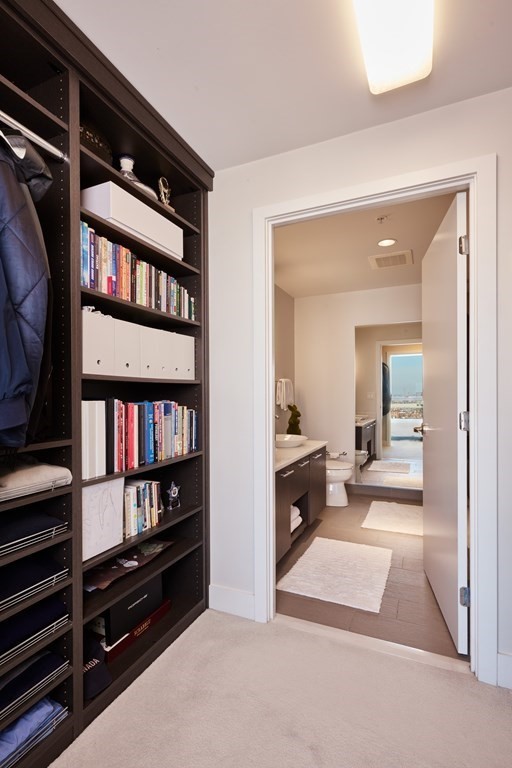 110 Stuart Street, Unit 26F Boston, MA 02116 - Photo 13 of 24 a view of living room with furniture and book shelf