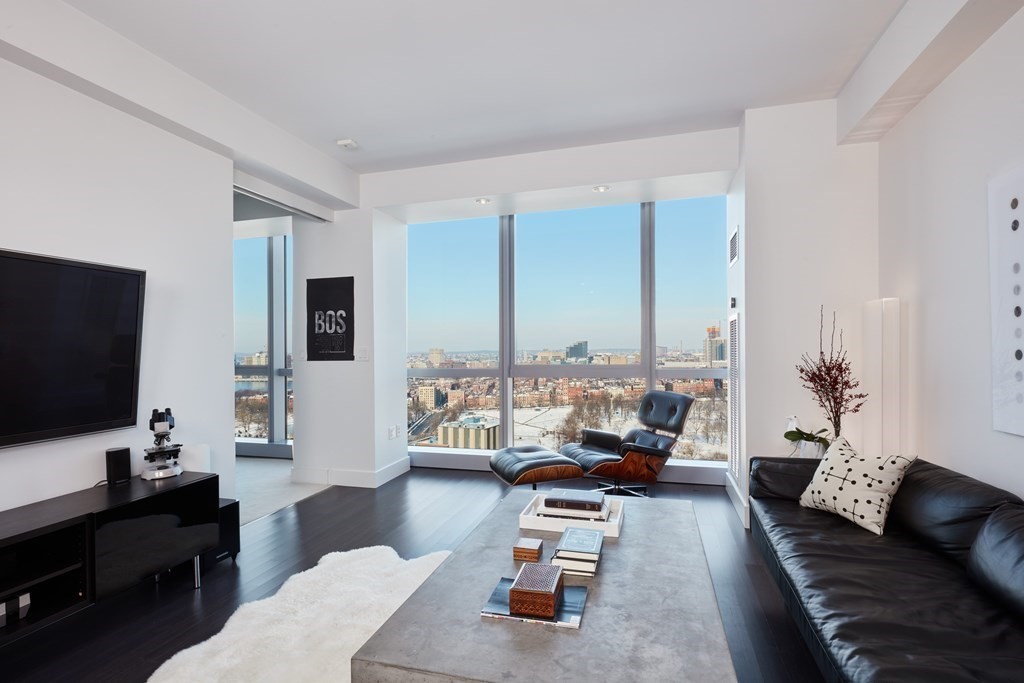110 Stuart Street, Unit 26F Boston, MA 02116 - Photo 2 of 24 a living room with furniture and a flat screen tv