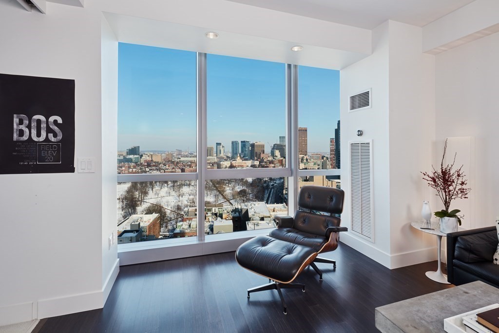 110 Stuart Street, Unit 26F Boston, MA 02116 - Photo 4 of 24 a living room with furniture and a floor to ceiling window