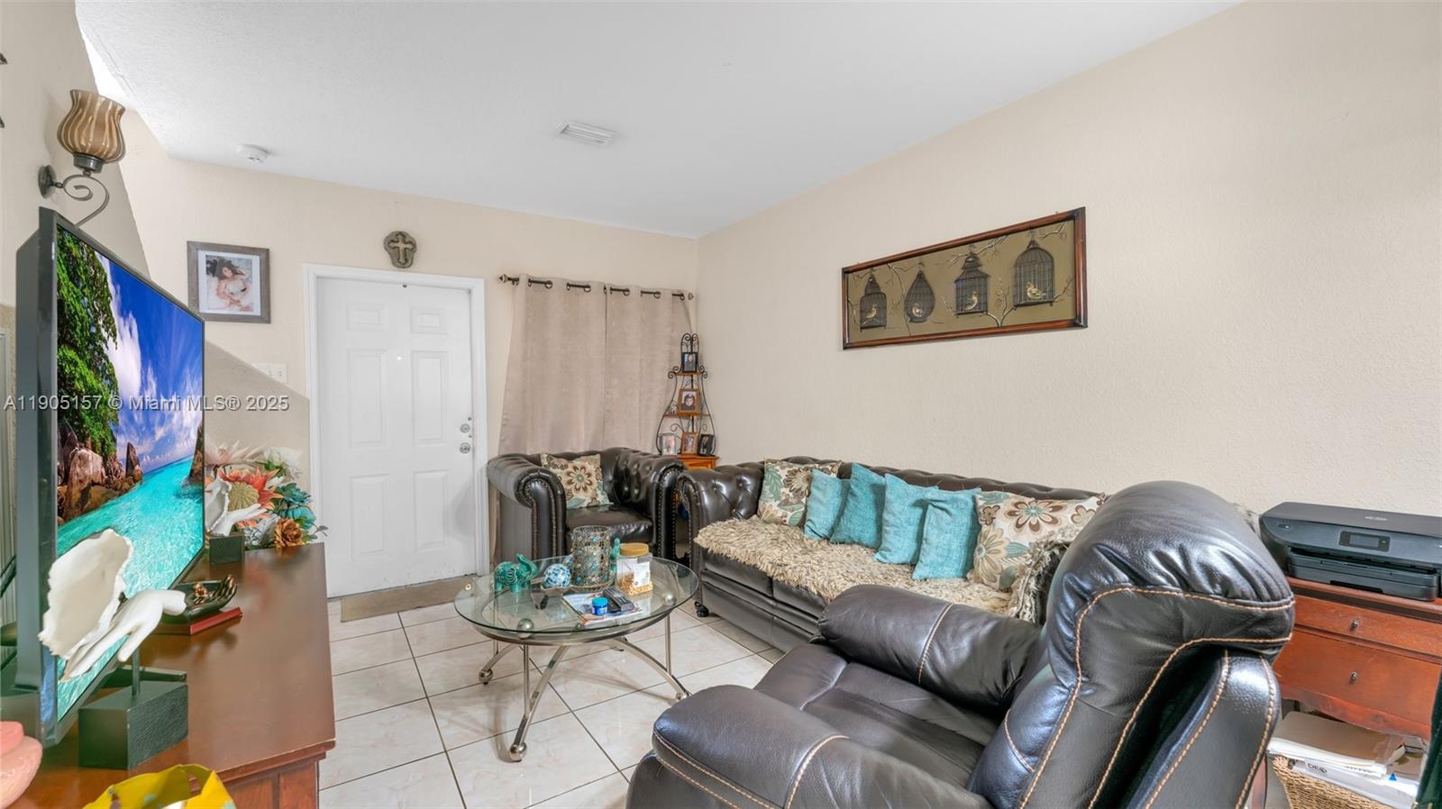 2993 West 80th Street, Unit 29 Hialeah, FL 33018 - Photo 11 of 21 a living room with furniture and a flat screen tv