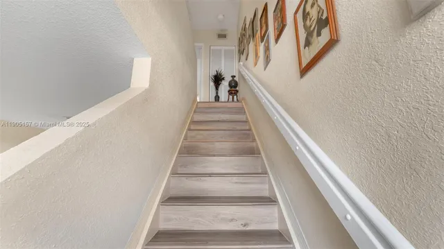 a bathroom with a toilet a sink and a mirror