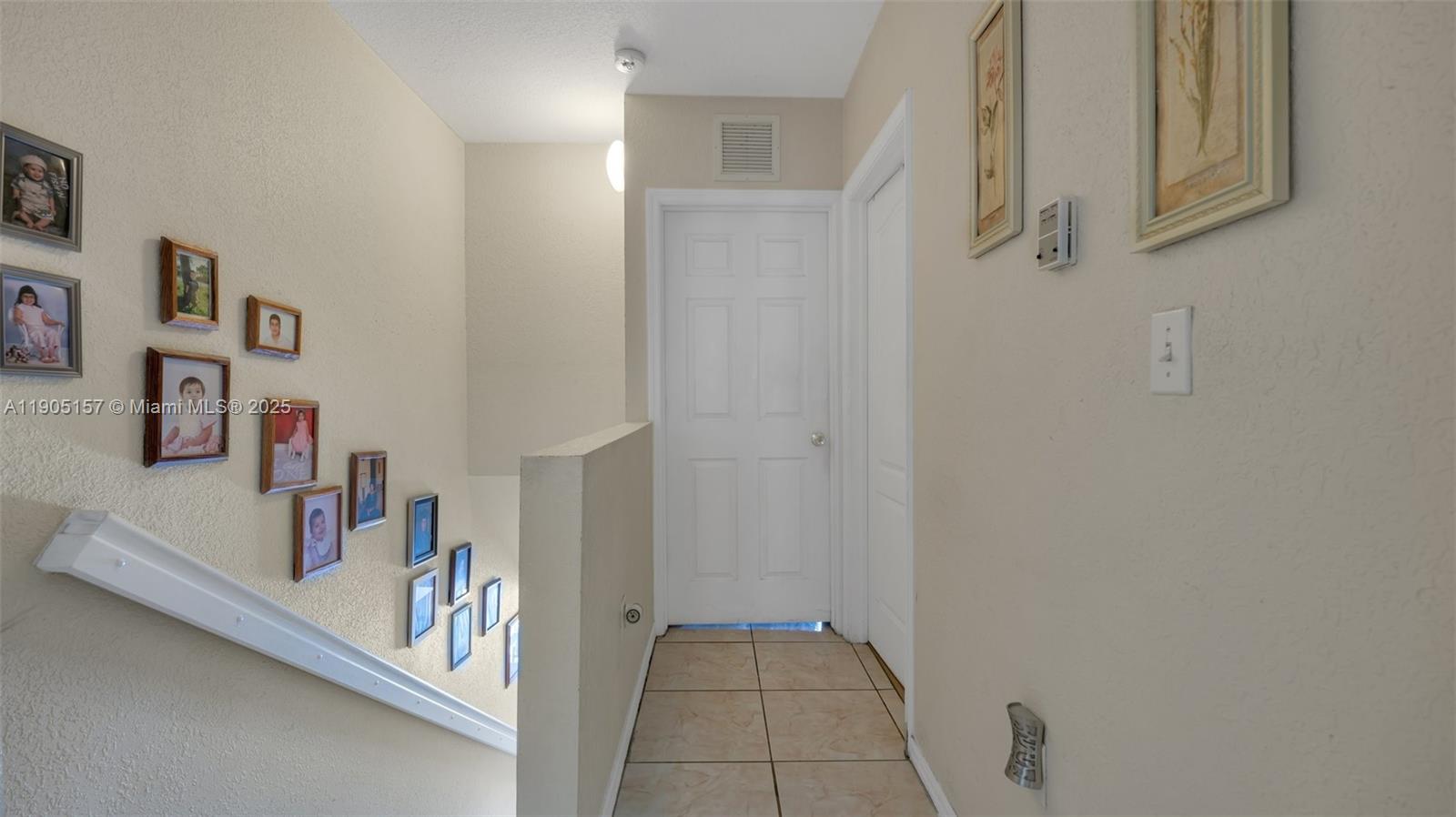 2993 West 80th Street, Unit 29 Hialeah, FL 33018 - Photo 17 of 21 a view of a hallway to rooms and stairs