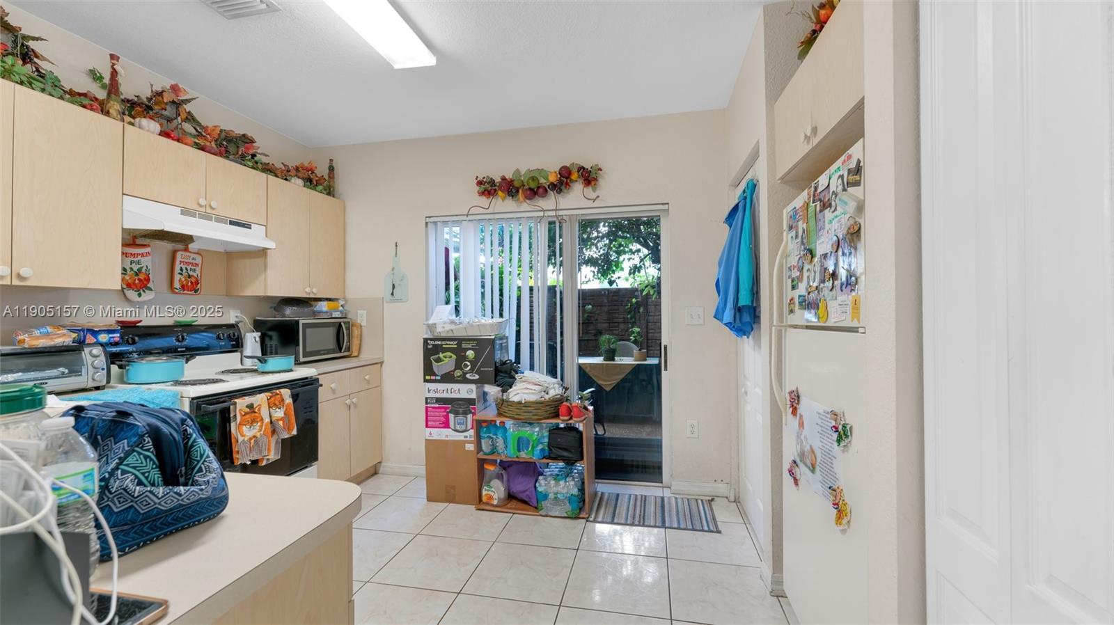 2993 West 80th Street, Unit 29 Hialeah, FL 33018 - Photo 5 of 21 a living room with furniture and a window