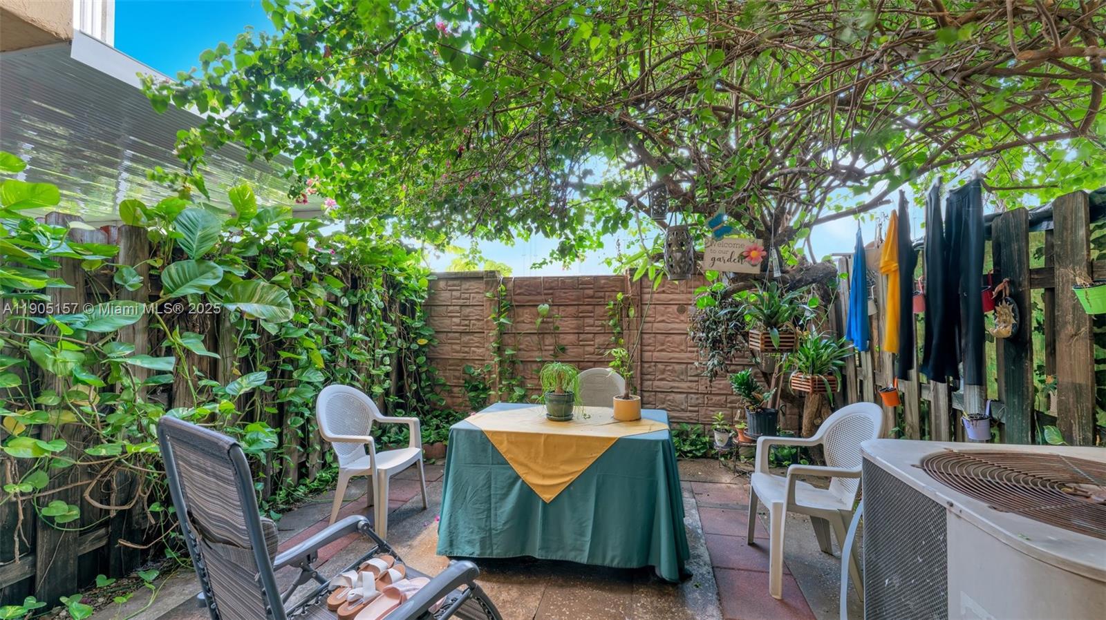 2993 West 80th Street, Unit 29 Hialeah, FL 33018 - Photo 7 of 21 a view of a chairs and table in the patio