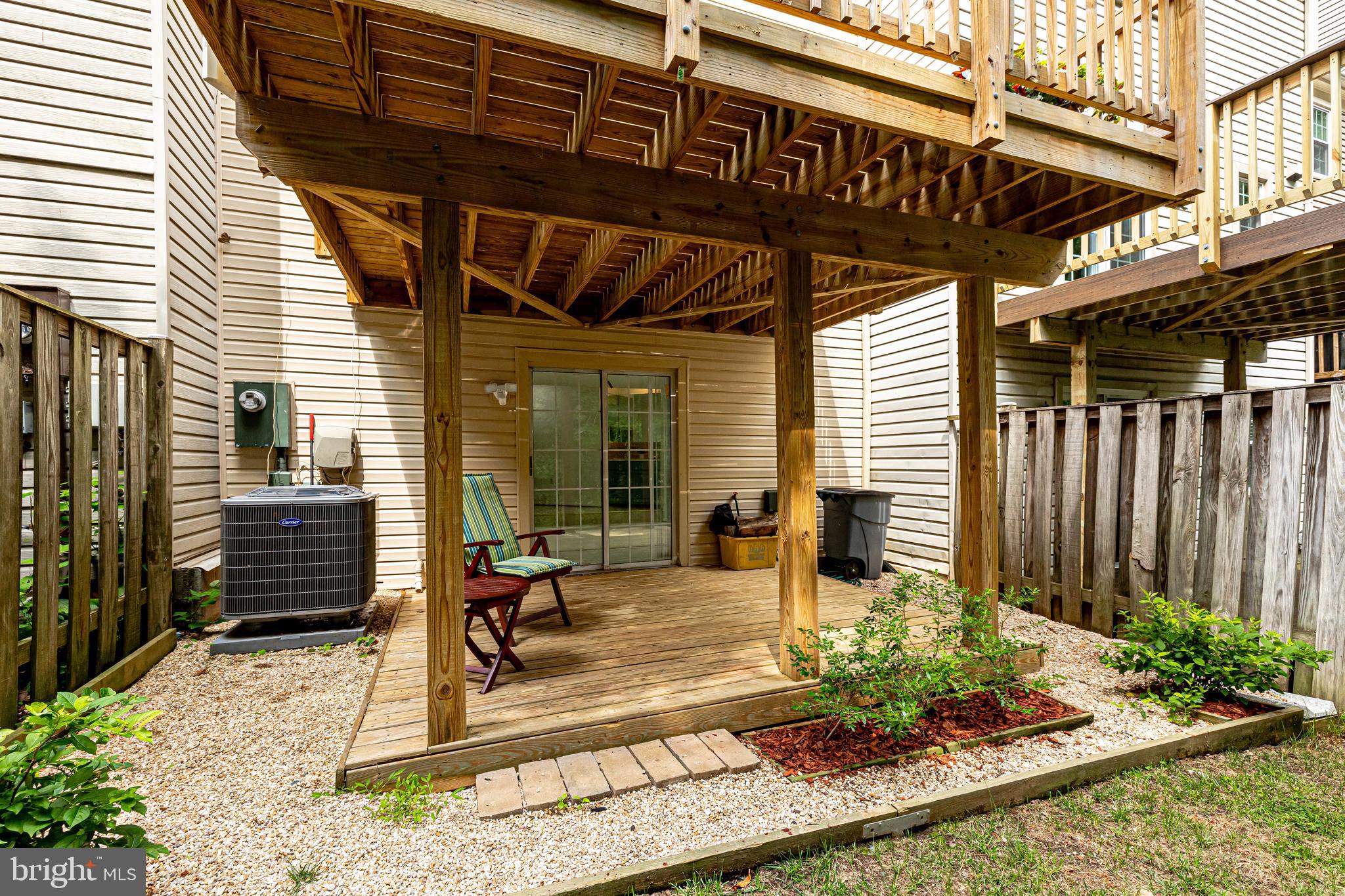 11962 Sentinel Point Court Reston, VA 20191 - Photo 52 of 62 The lower level deck has a private setting.