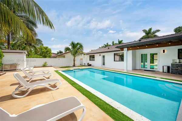 a view of a house with swimming pool