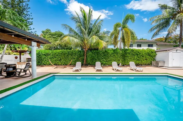 a view of swimming pool with a patio