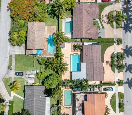 an aerial view of multiple houses with outdoor space