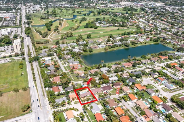 an aerial view of residential houses with outdoor space