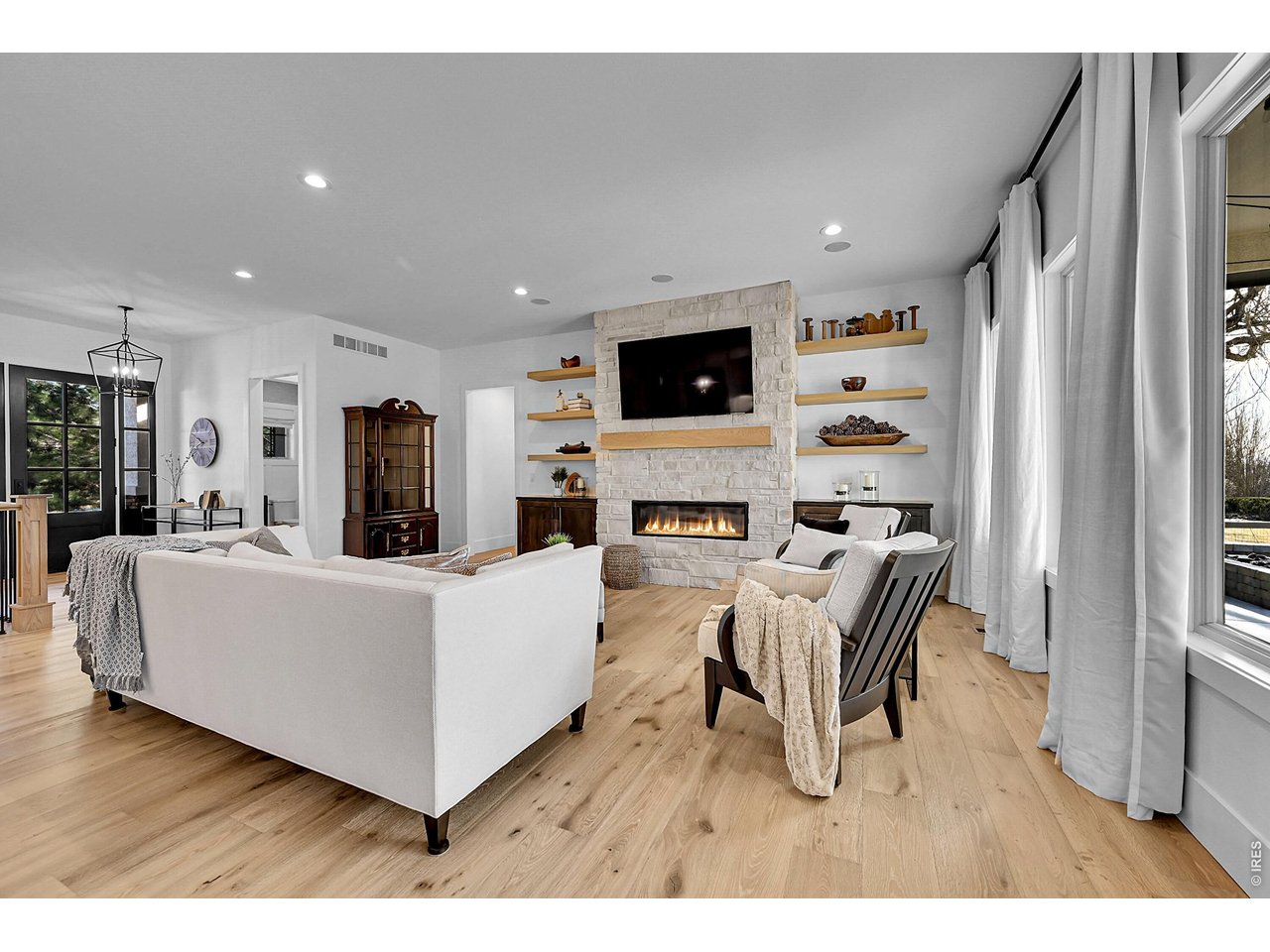 6582 Rookery Road Fort Collins, CO 80528 - Photo 7 of 50 Floor-to-ceiling stone fireplace