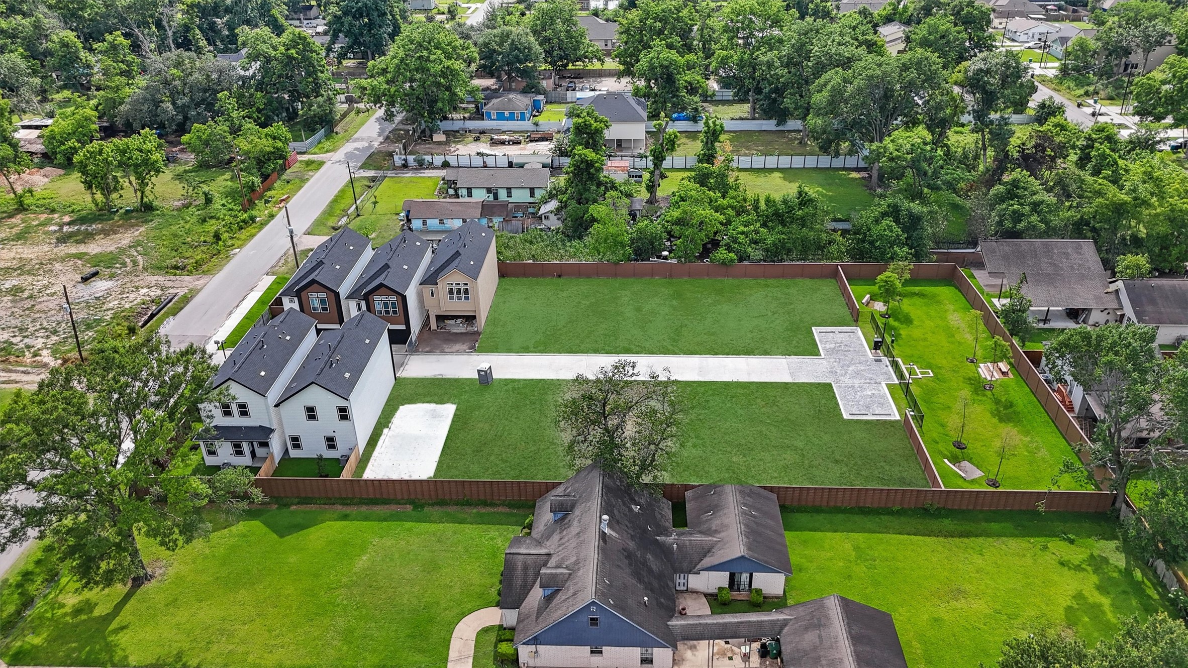 2110 Dewalt Street, Unit HG Houston, TX 77088 - Photo 22 of 22 an aerial view of a house with a garden and swimming pool