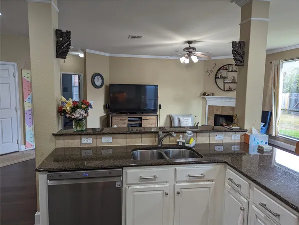 a kitchen with sink stove top oven and microwave