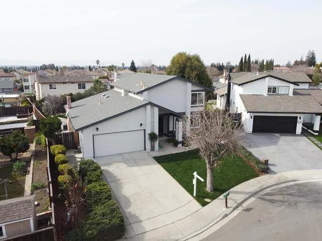 a picture of a bench in front of a wall