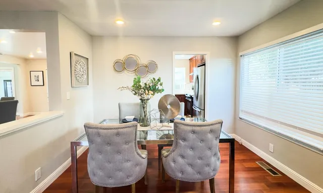 a bathroom with a sink mirror and toilet
