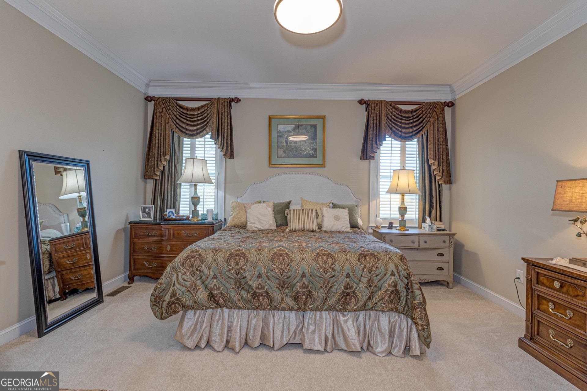 551 Mountain Ridge Drive Manchester, GA 31816 - Photo 25 of 72 Window treatments remain. The primary bedroom offers plush carpeting.