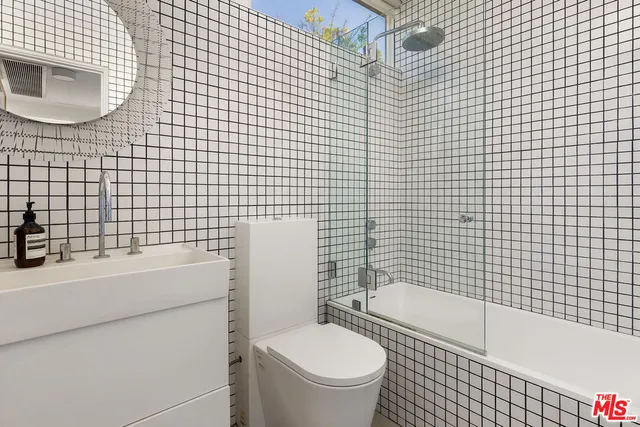 a bathroom with a toilet and a sink