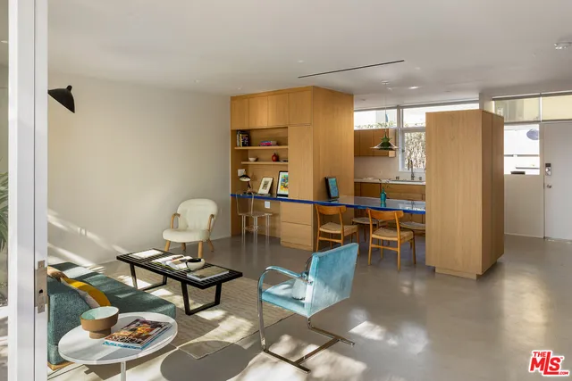 a living room with furniture and a table