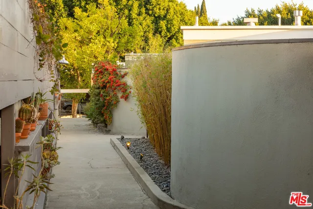 a living room with furniture a rug and a large window