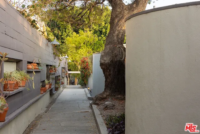 a bathroom with a glass door and shower