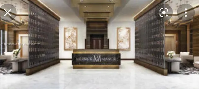 a view of lobby with a couch and a fireplace