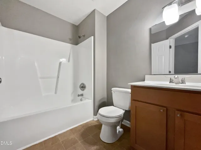 a kitchen with stainless steel appliances granite countertop a refrigerator and a stove