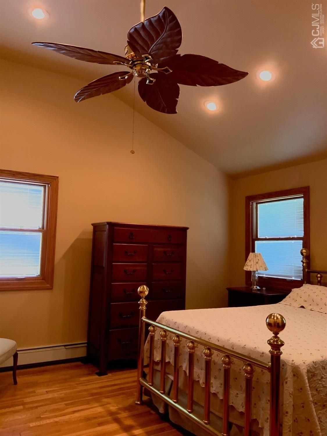 25 Penn Street Fords, NJ 08863 - Photo 12 of 20 a bedroom with a bed and a dresser