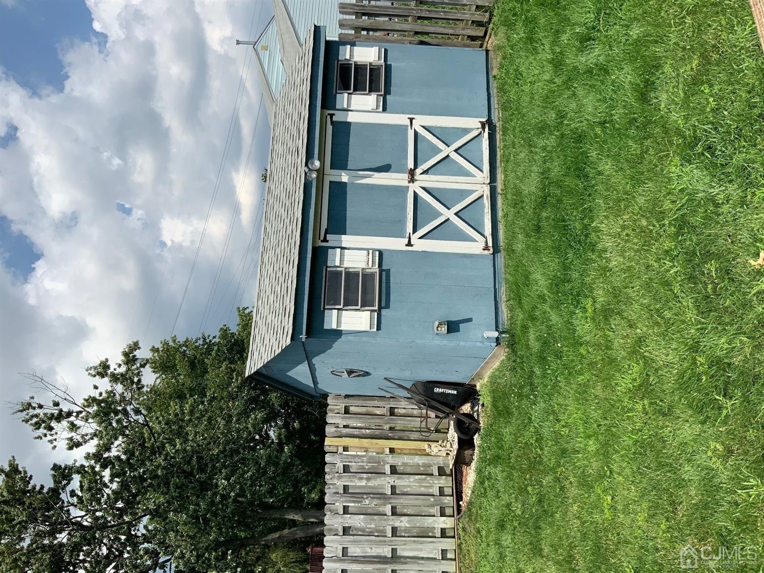 25 Penn Street Fords, NJ 08863 - Photo 20 of 20 a front view of a house with a yard