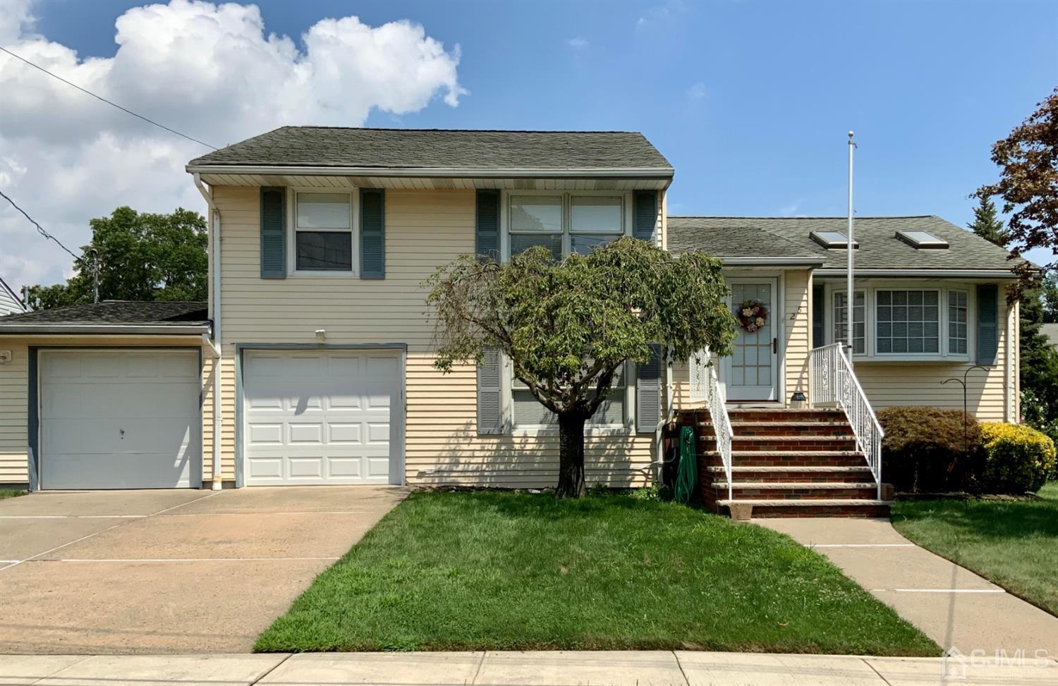 25 Penn Street Fords, NJ 08863 - Photo 2 of 20 a front view of a house with a garden