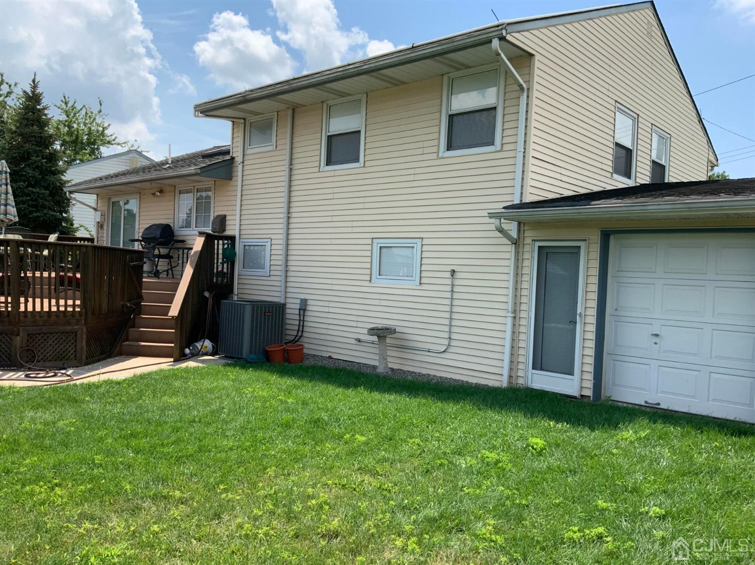 25 Penn Street Fords, NJ 08863 - Photo 3 of 20 a view of a house with a yard and stairs