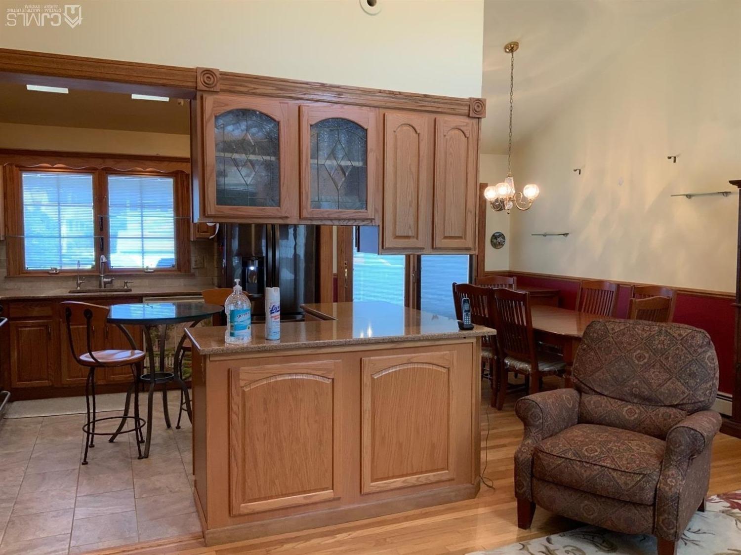 25 Penn Street Fords, NJ 08863 - Photo 9 of 20 a living room with furniture a window and a clock