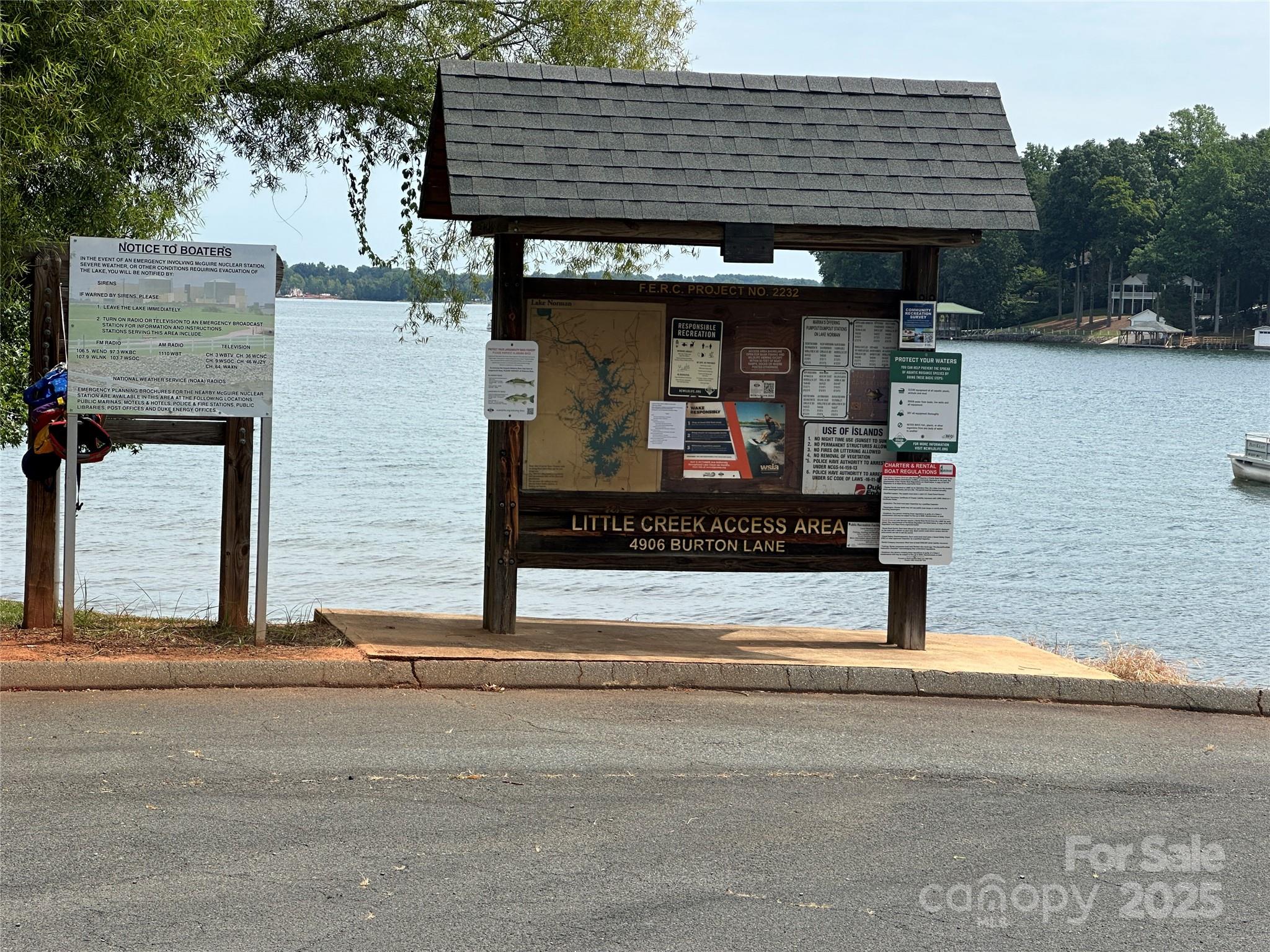 0 Webbs Road Denver, NC 28037 - Photo 7 of 8 a view of a house with entrance stairs and a car parked side of road