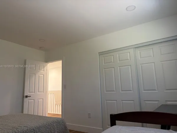 a room with a bed and a window