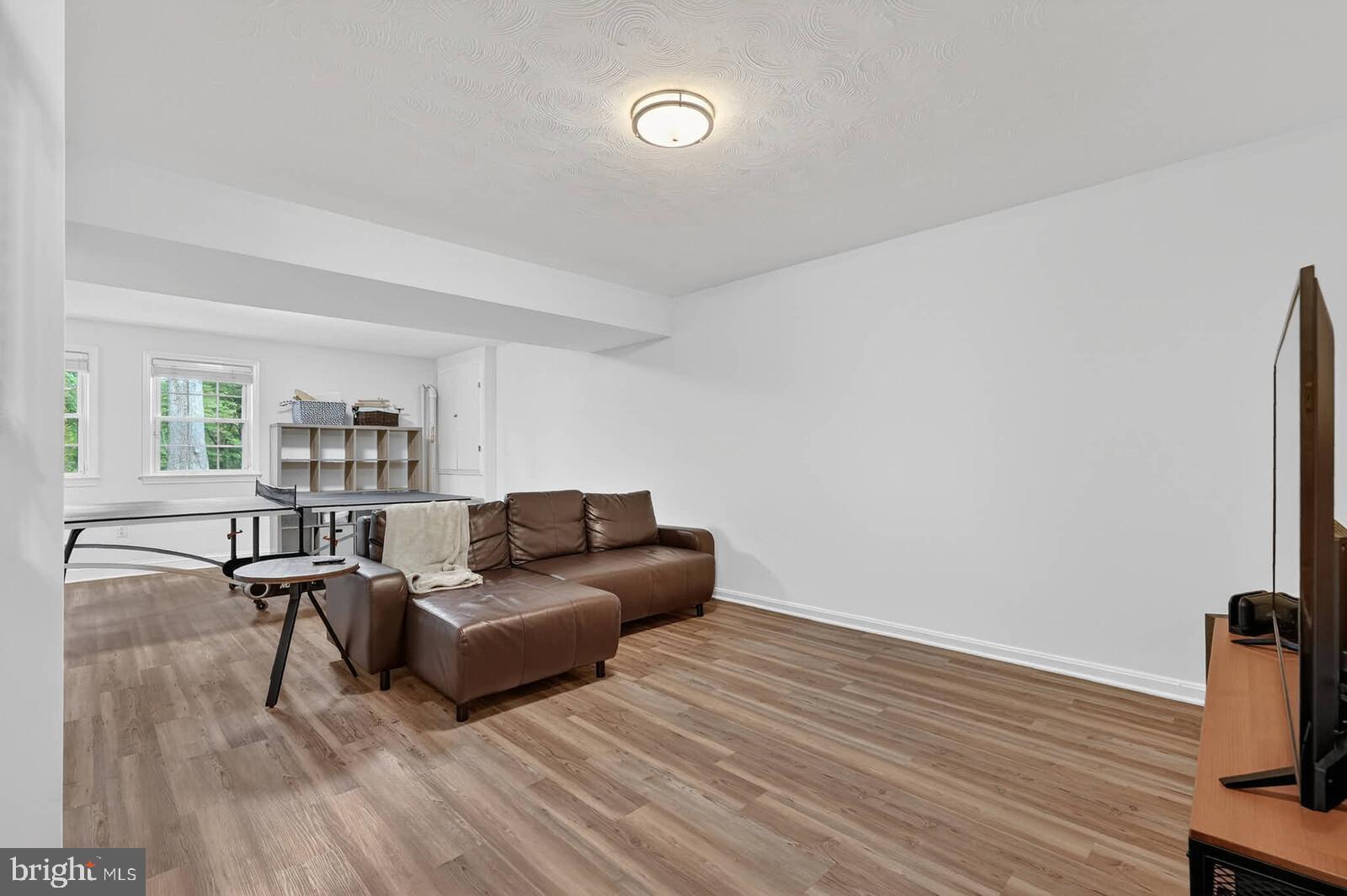 500 Finsbury Road Silver Spring, MD 20904 - Photo 34 of 54 a living room with furniture and a wooden floor