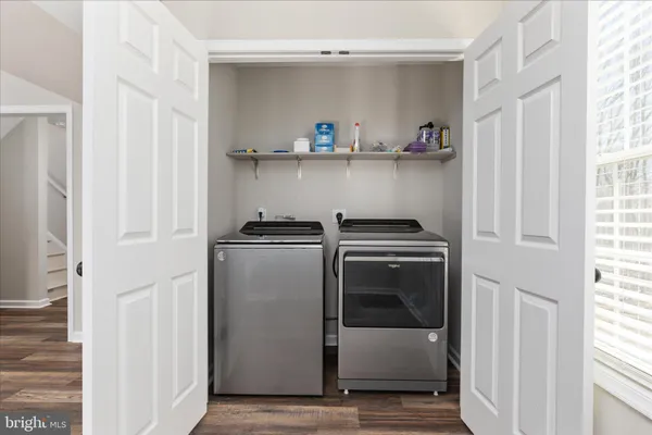 a view of storage and utility room with washer and dryer