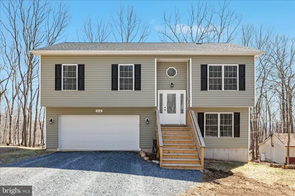 a front view of a house with stairs