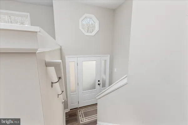 a view of a hallway with entryway